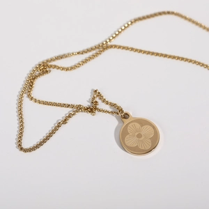 Retro golden stainless steel long necklace featuring a circular clover pendant charm