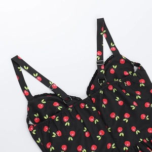 Detail of adjustable straps and cherry print on black V-neck summer beach dress