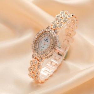 Luxurious rose gold quartz watch for women with sparkling crystal leaves and oval dial