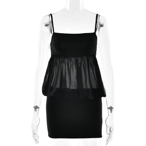 Sexy black bodycon dress with sheer chiffon overlay and spaghetti straps on mannequin