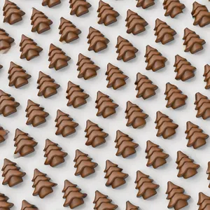 Detail of small Christmas tree shaped brown silicone chocolate mold with three-tier design
