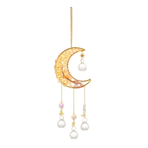 Detail of moon-shaped suncatcher with yellow crystals and sparkling prism balls