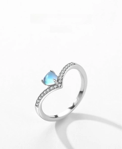 Close-up of V-shaped S925 silver ring with moonstone and pavé zircon details