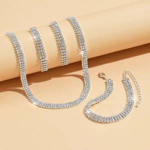 Three-row silver rhinestone bridal jewelry set with sparkling necklace and bracelet