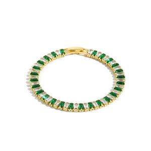 Golden tennis bracelet with emerald green and clear white rectangular zircon stones
