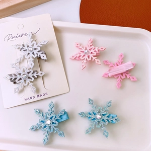 Glittery snowflake hair clips with rhinestones in silver, pink and blue for girls