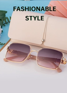 Close-up of square metal sunglasses with gradient lenses and cream leather pouch