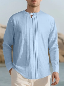 Close-up of light blue linen Henley shirt featuring vertical pleated texture and buttons