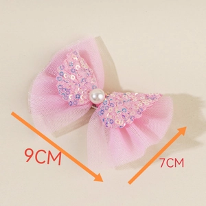 Detail of pink bow hair clip for cats with white pearl and colorful sequins, 9cm x 7cm size