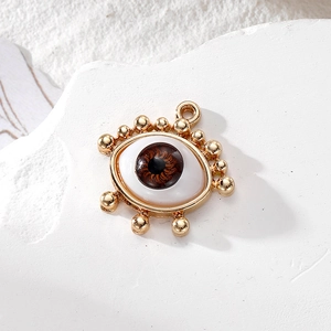 Evil eye pendant with brown iris and gold-tone beaded frame for DIY jewelry