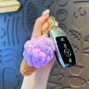 Handmade crochet colorful ice cream keychain with purple yarn scoop and golden ring
