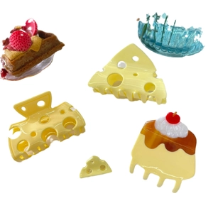 Cute food-themed acetate hair claws featuring pudding, cheese, and cake dessert shapes