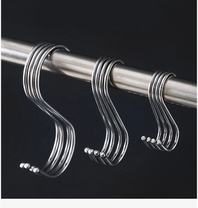 Three sizes of silver S-shaped stainless steel hooks hanging on a metal rod