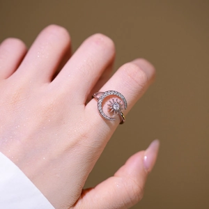 Exquisite sun and moon open ring with shimmering cubic zirconia stones on female hand