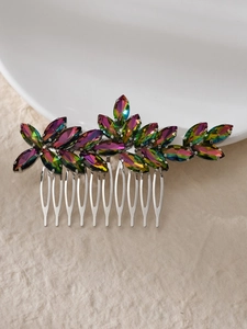 Macro shot of silver bridal hair comb with marquise cut iridescent crystal leaves