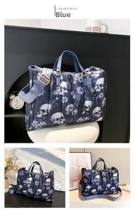 Detail of blue skull print tote bag featuring quilted texture and adjustable gold strap buckle