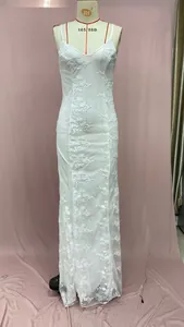 Close-up of intricate 3D floral embroidery on a white mesh lace evening gown dress
