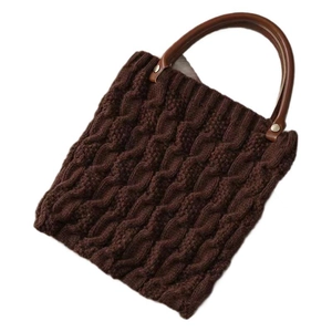 Brown chunky knit handbag for women with thick woven texture and a round handle