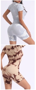 Detailed view of tie-dye ribbed yoga rompers with body-shaping elastic fabric