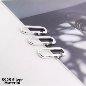 Macro shot of three S925 sterling silver oval spring clasps for DIY jewelry making
