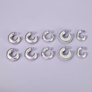 Set of five diverse silver stainless steel hoop earrings with polished and textured finishes