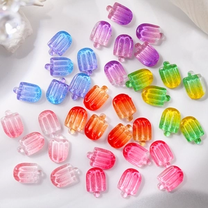 Detailed view of colorful 3D resin ice cream nail charms with glitter and jelly texture