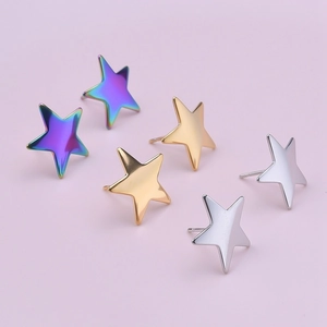 Three pairs of stainless steel star earrings in multicolor, gold, and silver finishes