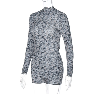 Close-up detail of sheer mesh floral jumpsuit with elegant high neck and slim fit