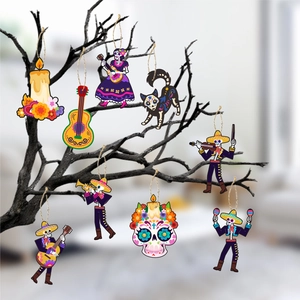 Detailed view of eight Day of the Dead skeleton ornaments hanging on tree branches