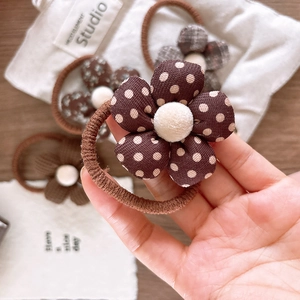 Brown floral fabric hair scrunchies with polka dots and stripes for girl hair styling