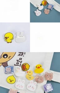 Detail showing the durable metal safety pin on the back of acrylic cartoon duck brooches