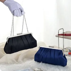 Elegant pleated satin evening clutch bag with rhinestone clasp and silver chain strap