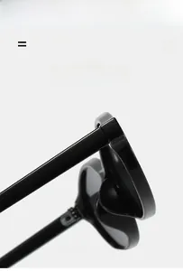Detail of high-elasticity metal hinges on lightweight black vintage sunglasses