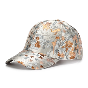 Close-up of intricate floral and dragon embroidery on a premium jacquard baseball cap