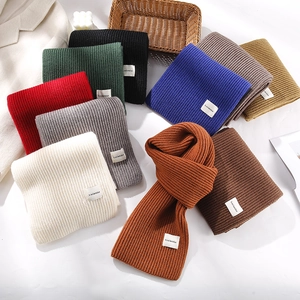 Detailed knit texture and color options of the chunky winter snowman scarf collection