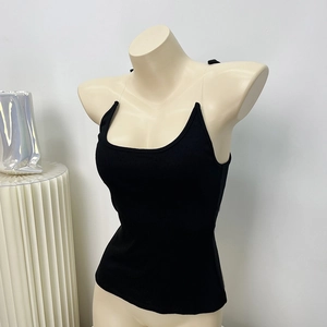 Detail of black ribbed knit camisole featuring slim fit and transparent invisible straps