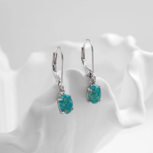 Elegant s925 silver lever-back earrings with oval fire opal and four-claw setting