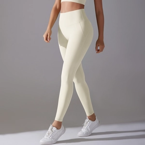 Detailed side view of off-white high waisted yoga leggings showing fit and texture