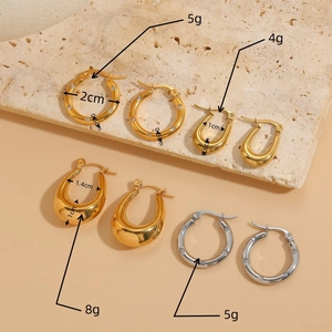 Titanium steel chunky gold earrings set with cubic zirconia and teardrop designs