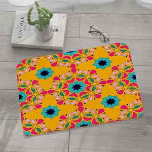 Colorful bohemian flannel floor mat with geometric mandala patterns on light wood floor