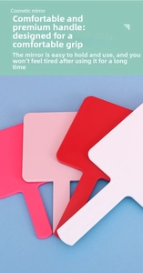 Detail of square handheld cosmetic mirrors in red, pink, and white with ergonomic handles