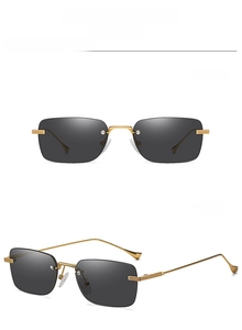 Close-up of rimless square sunglasses in gold-black with metal temples and gradient lenses