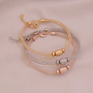 Three-piece stretch mesh C-shape bracelets set in gold, silver and rose gold metal