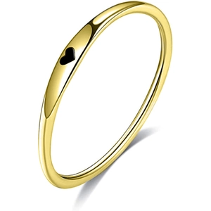 Minimalist gold stainless steel ring featuring a black enamel heart on a white background