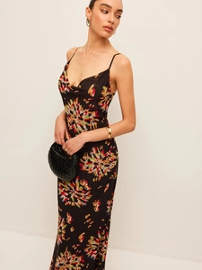 Floral print camisole maxi dress in black silk style with vibrant multi-colored patterns