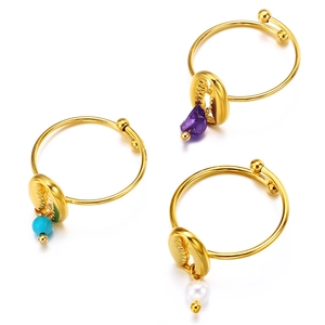 Three-piece gold hoops set with sea shell pendants, natural gemstones and pearls