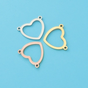 Detailed view of heart-shaped jewelry connectors in silver, gold, and rose gold finishes