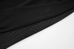 Detailed close-up of breathable black mesh fabric texture and fine weaving pattern