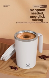 Detailed view of white automatic magnetic coffee mug with stainless steel liner on wood tray