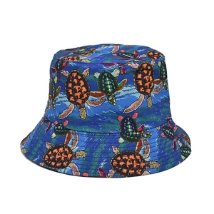 Classic bucket hat featuring colorful sea turtle print on a deep blue canvas background
